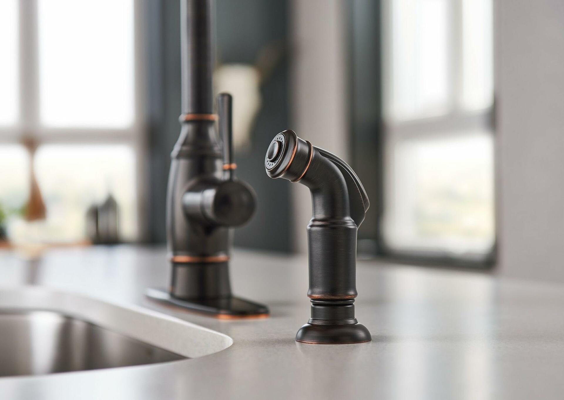 MOEN Noell 87506BRB Single-Handle Standard Kitchen Faucet with Side Sprayer in Mediterranean Bronze